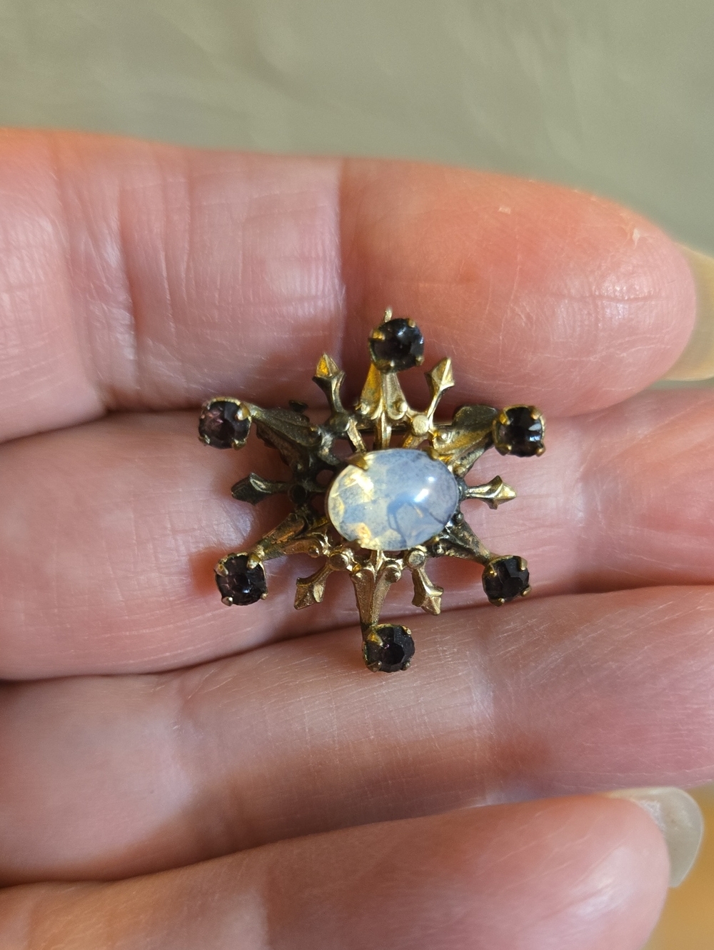Vintage Gold Tone Brooch with Opalescent Center and Purple Accent Stones